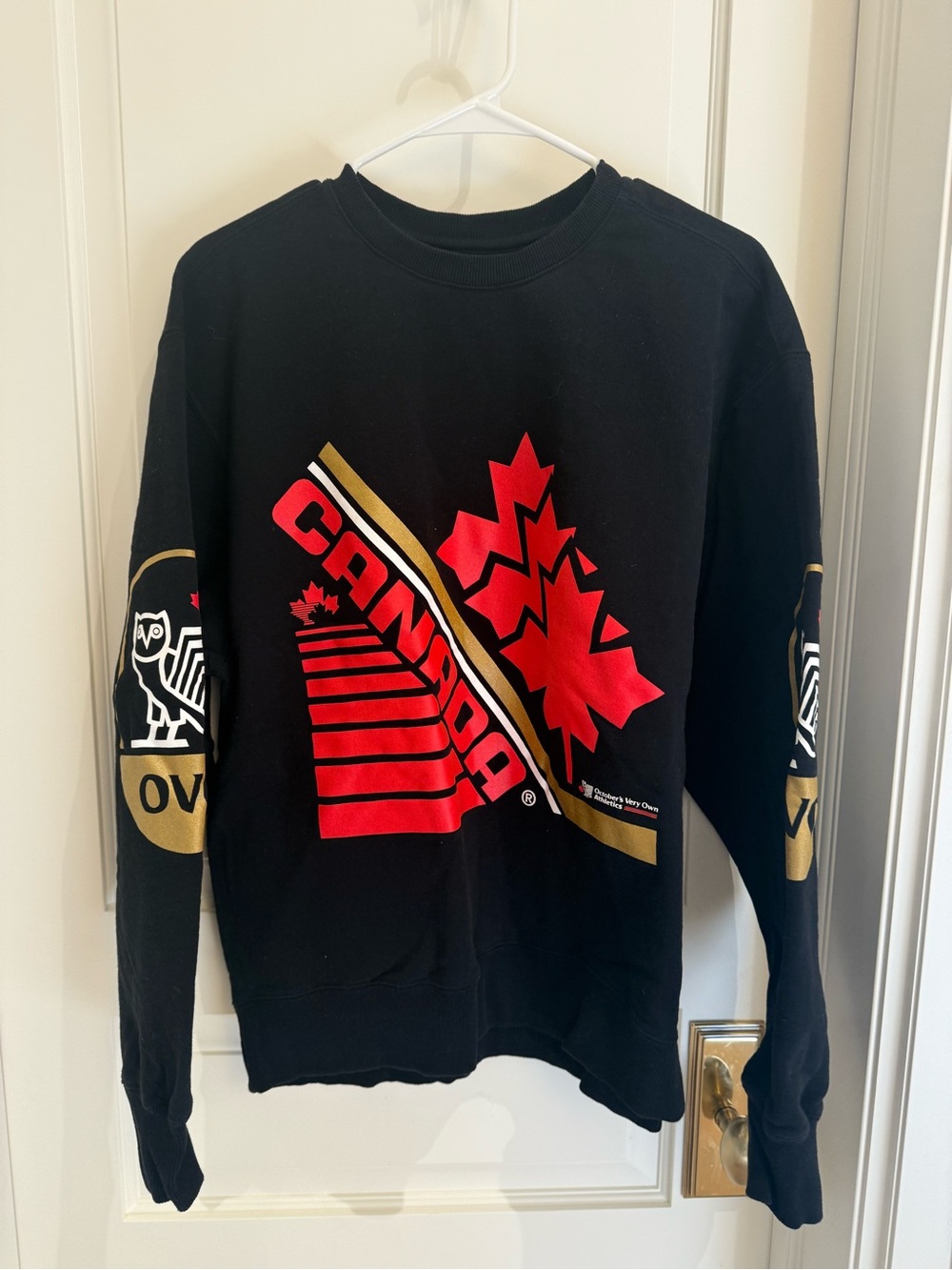 OVO Black Crewneck with Red Maple Canada Graphic and Gold Accents